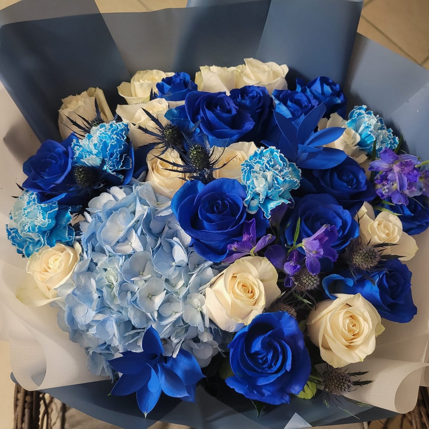 Artistic blue and white flower bouquet available in Boca Raton