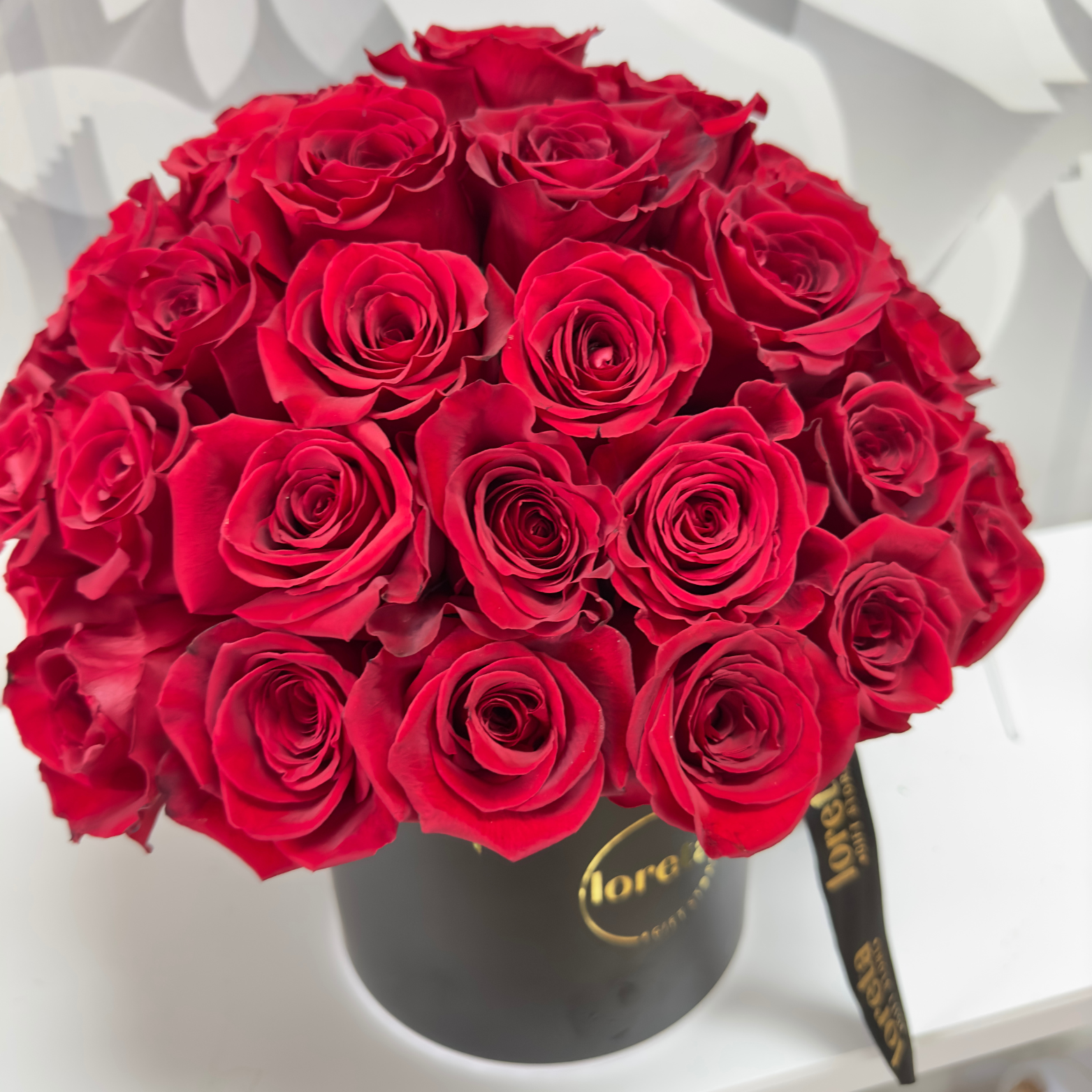 Blooming Roses floral arrangement with long-stem roses for Valentine's Day and anniversaries.